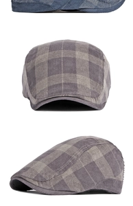 Detailed view of vintage plaid ivy cap featuring grey check pattern and corduroy texture