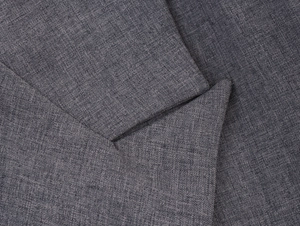 Detailed macro view of the grey cross-weave texture on this business casual blazer