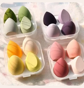 Close-up of 4-piece makeup sponge sets in various colors with transparent storage cases