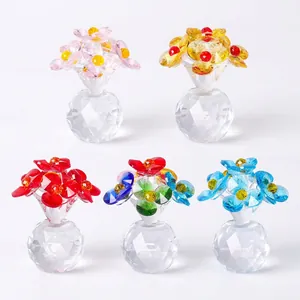 Five assorted colorful crystal flower ornaments with faceted glass bases for home decor