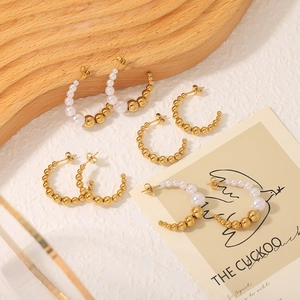 Classic C-shaped stainless steel earrings featuring gold beads and elegant pearls