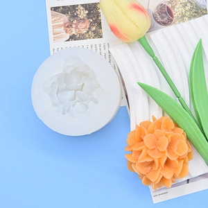 Handmade carnation flower silicone mold with finished orange floral scented soy candle