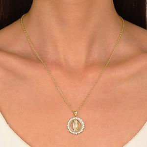 Close-up of Virgin Mary gold pendant necklace with micro-paved white stones on model