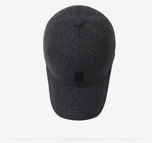 Top down view of a charcoal grey winter baseball cap featuring textured thick wool fabric