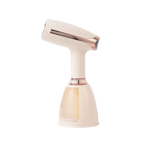 Ferro da stiro a vapore portatile beige e oro rosa con serbatoio dell'acqua trasparente