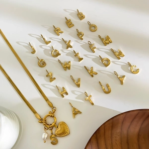 Golden flat snake chain necklace with heart, pearl, and 26 letter pendants set