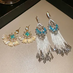 Sparkling crystal fan-shaped stud earrings and blue gemstone fringe drop earrings set