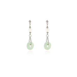 Detail view of silver tassel earrings with white pearl and green jadeite pendant