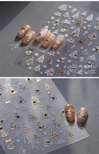 Macro detail of TL-274 Christmas nail stickers with 3D embossed snowflakes and gold edges