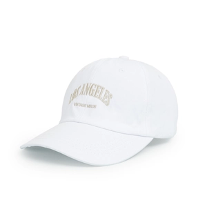 Detailed macro view of the vintage Los Angeles embroidery on a white cotton baseball cap