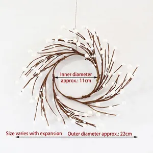 Handcrafted white berry candle ring wreath with decorative branches for festive home decor