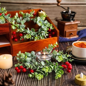 Christmas eucalyptus candle ring with red berries and glass holder for holiday decor