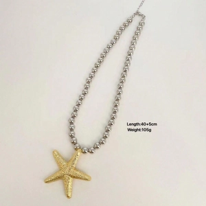 Statement gold starfish and silver bead necklace for women's elegant beach vacation style