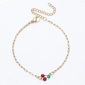 18K gold plated stainless steel bracelet with cherry pendant and red gemstones on white background