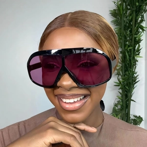 Fashionable oversized square sunglasses with black frame and purple gradient lenses