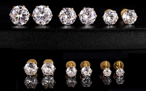 Macro display of six different sizes of gold-plated claw-set zircon stud earrings