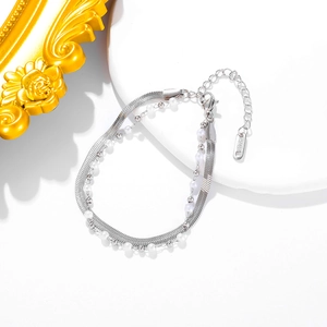 Double-layered silver stainless steel bracelet featuring sleek snake chain and white pearls