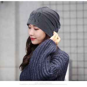 Close-up of dark grey slouchy beanie with bold black STAR lettering print for men