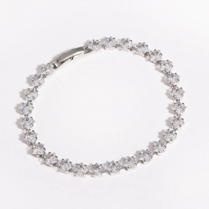 Detailed view of silver bracelet with square-cut cubic zirconia and classic clasp