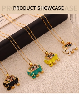 Detailed showcase of four elephant pendants with multi-colored crystals on gold necklaces