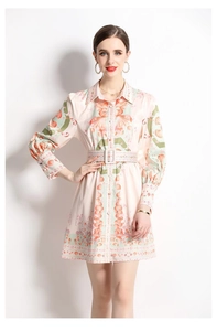 Detail of V-neck long sleeve dress with orange shell prints and matching waist belt