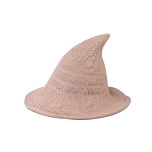 Detail of pink knitted witch hat showing high-quality crochet texture and pointed top