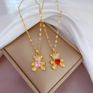 Titanium teddy bear necklaces with pink and red heart zircons on white silk