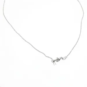 Detailed macro view of S925 silver adjustable chain with lobster clasp and slider bead