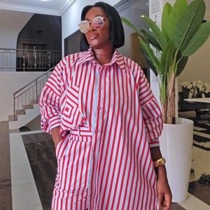 Women's plus size red and white vertical striped long sleeve shirt with a loose fit
