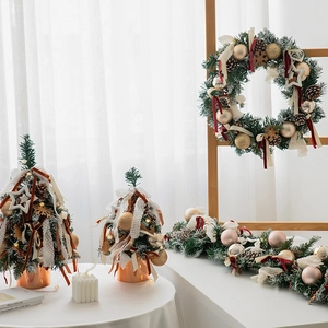 Mini Christmas tree with pine cones and champagne gold ornaments for tabletop decoration