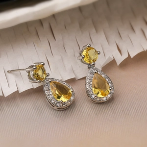 Luxurious pear-cut yellow zircon teardrop earrings with halo crystals in silver setting