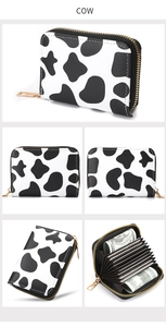 Detailed views of cow print accordion wallet featuring multiple card slots and zipper closure