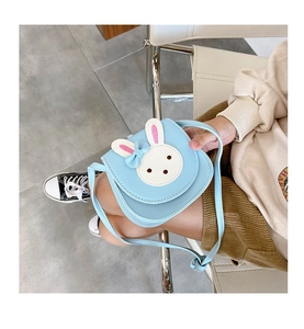 Detail shot of cute light blue bunny crossbody bag for kids with 3D rabbit ears