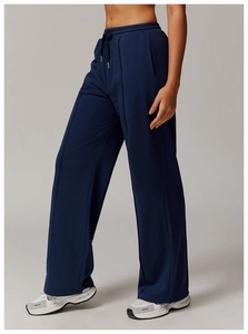 Detail of high waist navy blue wide leg sweatpants with drawstring and vertical seam