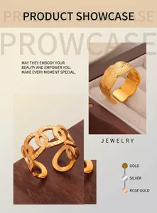 Close-up of gold-plated woven texture and hollow chain adjustable rings on velvet