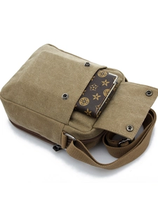 Men's khaki canvas crossbody bag with multi-pocket design and adjustable strap