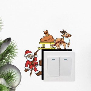 Sticker mural de Noël avec Père Noël et renne pour décorer un interrupteur mural