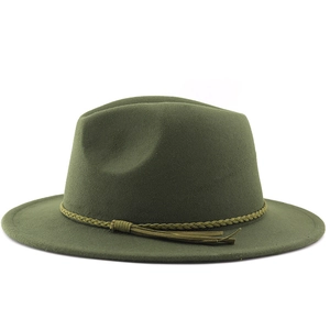 Detailed view of the dark green wide brim fedora with woven band and tassel accents