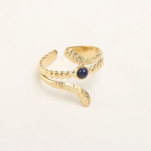 Detail of gold-plated hammered ring featuring a round blue lapis lazuli stone setting