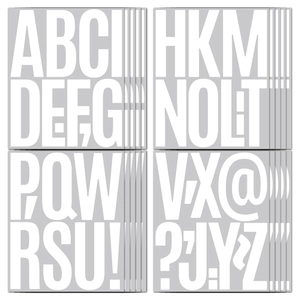 Detail view of large white uppercase letter stickers and punctuation for home decor