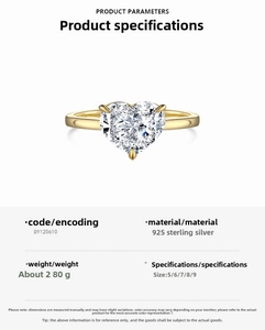 Detail view of heart-cut clear zircon stone set in 925 sterling silver golden ring