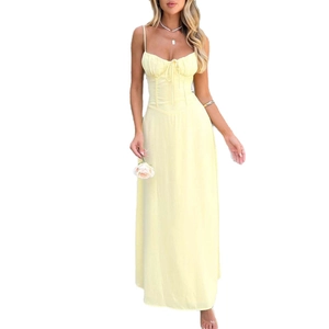 Elegant pale yellow camisole A-line maxi dress with corset bodice and flowing skirt