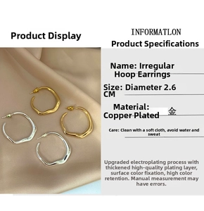 Detailed view of 26mm irregular hoop earrings in gold and silver plating