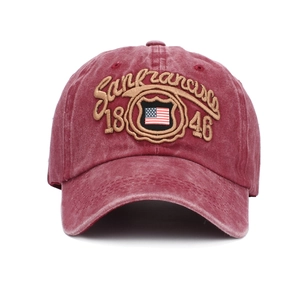 Detail of embroidered San Francisco 1846 logo and USA flag on burgundy washed cotton cap