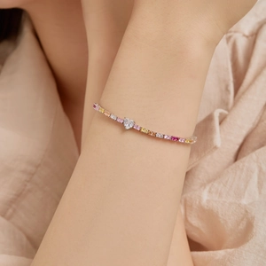 Detail of S925 silver tennis bracelet with colorful zircons and heart shaped crystal