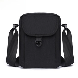 Front view of large black nylon crossbody chest bag with adjustable strap and buckle