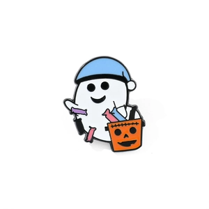 Detail of Halloween ghost enamel pin wearing a blue hat and holding a pumpkin bucket