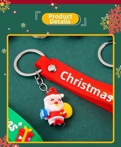 Detail of Christmas keychain with Santa charm and red silicone wristband with snowflakes