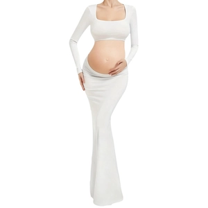 Elegant white maternity photo dress with long sleeve crop top and flowing mermaid skirt