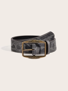 Detail of vintage Y2K belt featuring embossed leather and antique bronze buckle